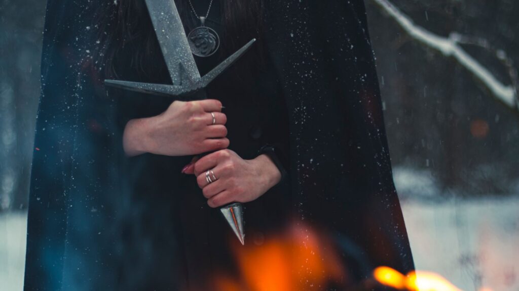 Person holding a sword