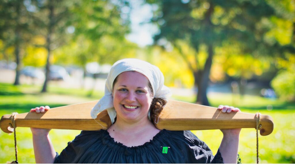 Woman carrying a wooden yoke